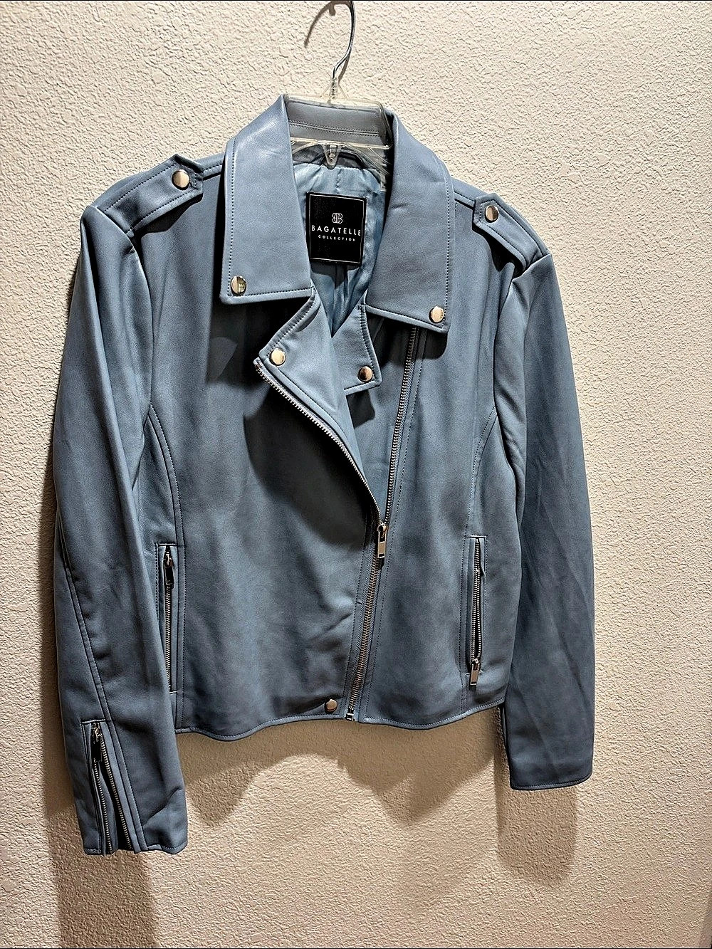 Moto Jacket in medium blue with silver zippers and snaps, NEW.